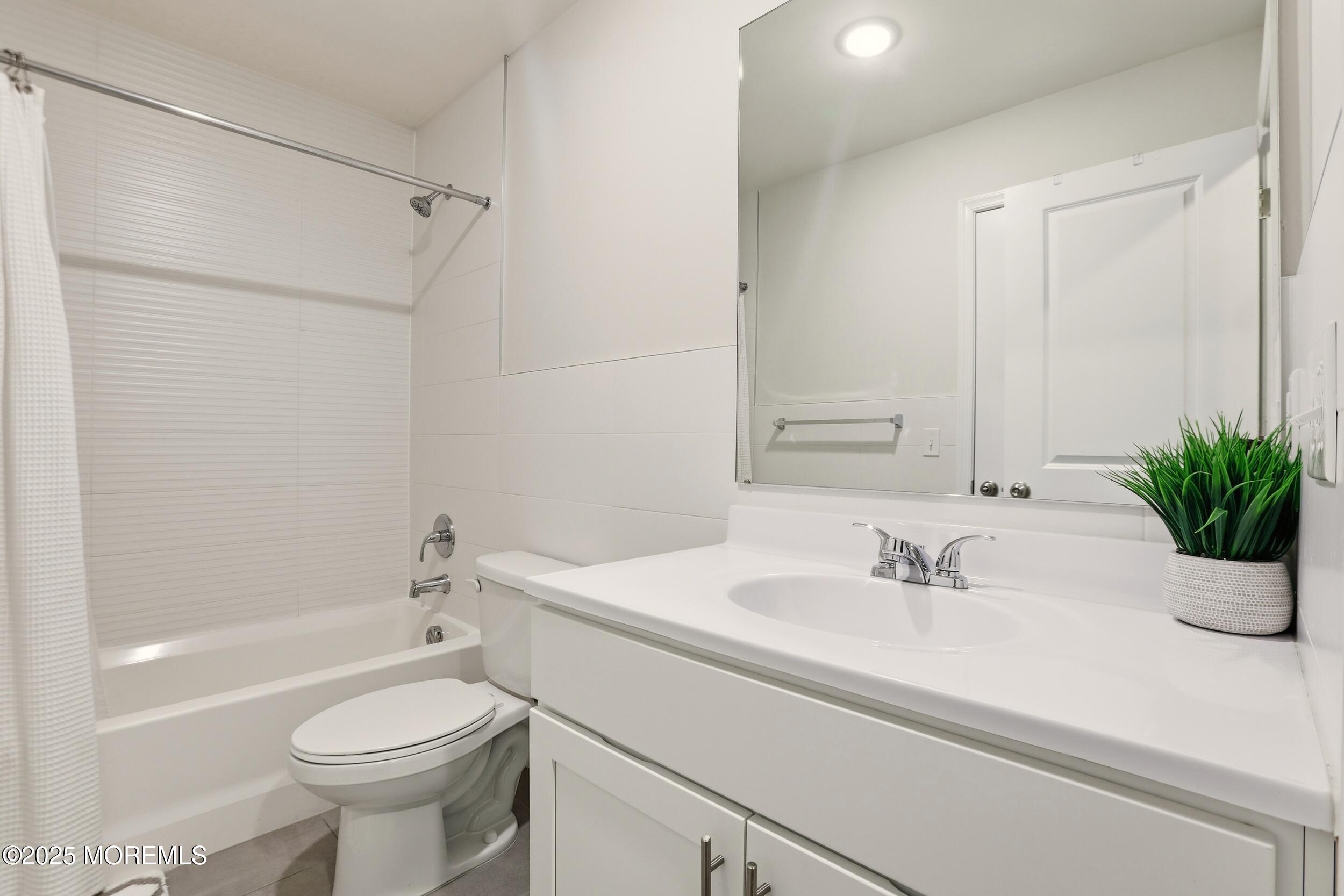 119 North Zinfandel Road Lakewood, NJ 08701 - Photo 23 of 29 a bathroom with a sink toilet and shower