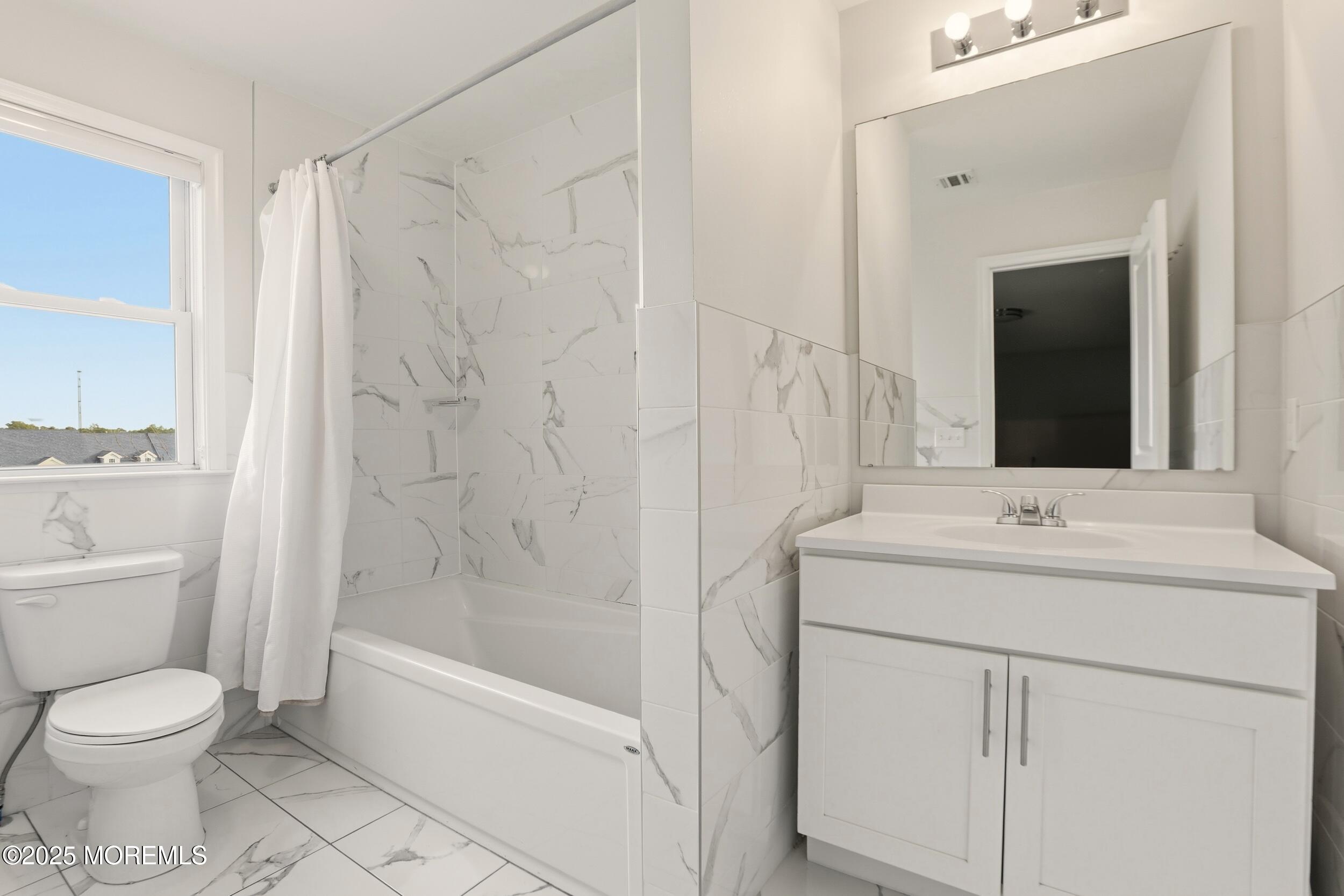 119 North Zinfandel Road Lakewood, NJ 08701 - Photo 25 of 29 a bathroom with a sink toilet and shower