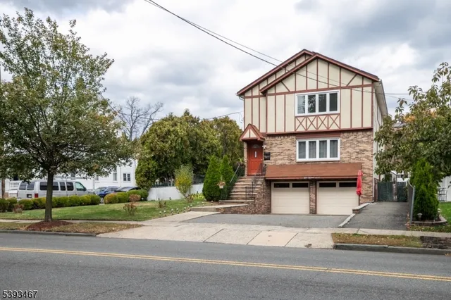 a view of a house with a yard and plants