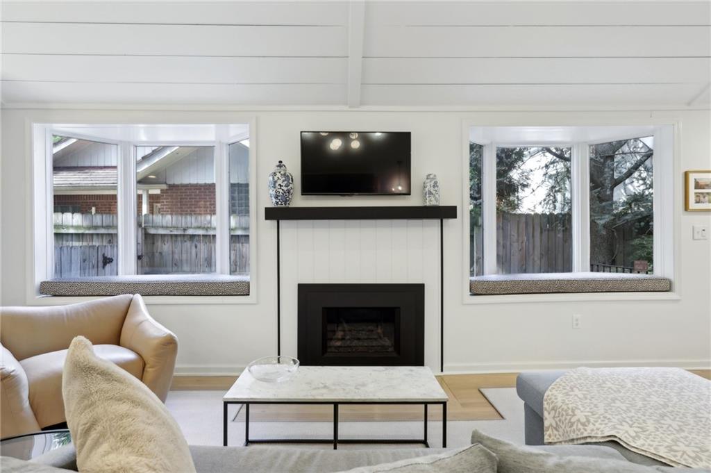 4912 Wallingford Street Pittsburgh, PA 15213 - Photo 5 of 45 a living room with furniture a flat screen tv and a fireplace