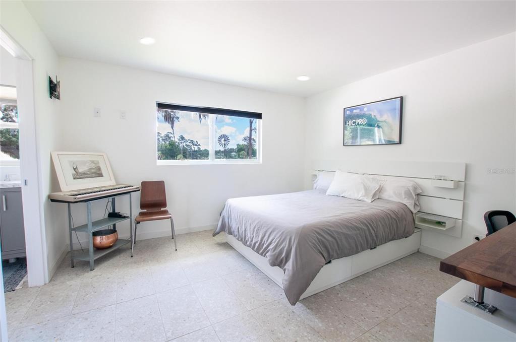 1635 Southwest Rodgers Avenue Arcadia, FL 34266 - Photo 17 of 32 a spacious bedroom with a bed a desk and chair