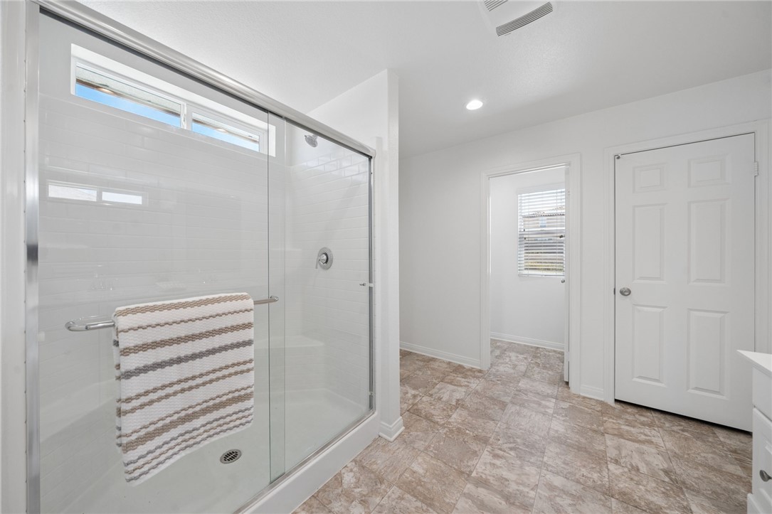 20130 Curaco Court Riverside, CA 92507 - Photo 26 of 43 Primary bathroom shower with an adjoining dressing or closet area.