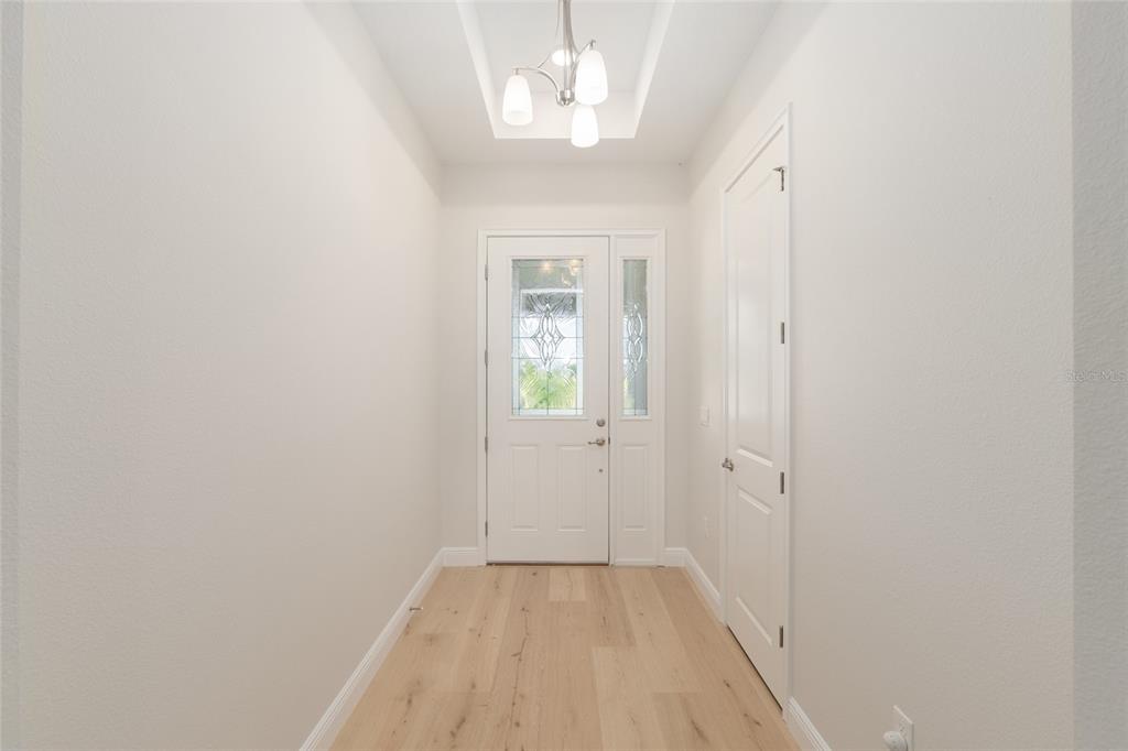 1929 Northwest 85th Loop Ocala, FL 34475 - Photo 11 of 55 wooden floor in a hall with an entryway