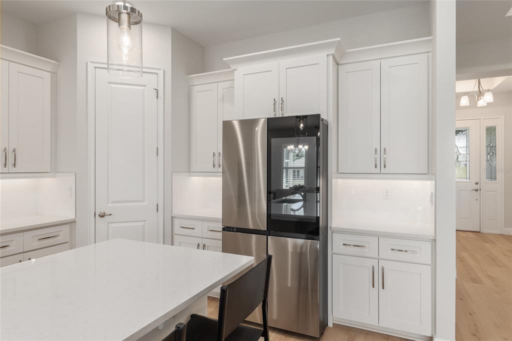 1929 Northwest 85th Loop Ocala, FL 34475 - Photo 18 of 55 a kitchen with white cabinets and refrigerator