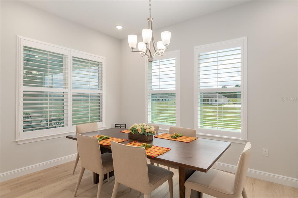 1929 Northwest 85th Loop Ocala, FL 34475 - Photo 20 of 55 a view of a dining room with furniture and windows