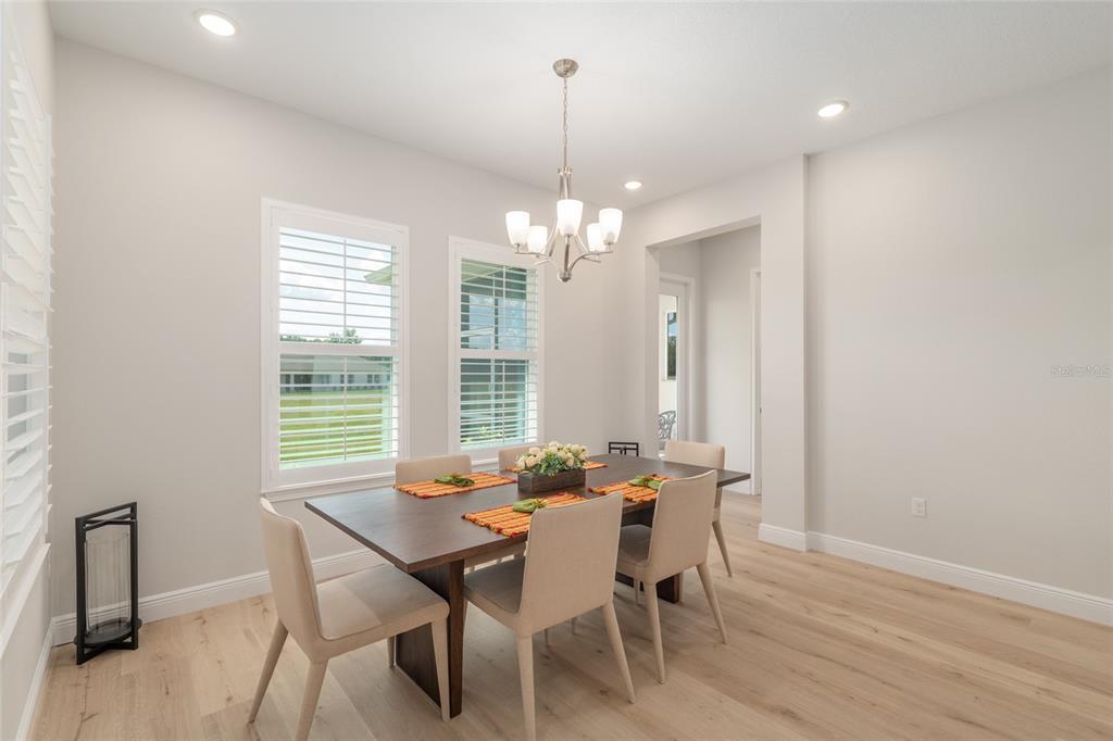 1929 Northwest 85th Loop Ocala, FL 34475 - Photo 21 of 55 a view of a dining room with furniture window and outside view