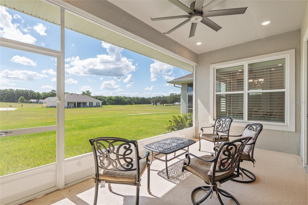 1929 Northwest 85th Loop Ocala, FL 34475 - Photo 25 of 55 a view of swimming pool with a table and chairs