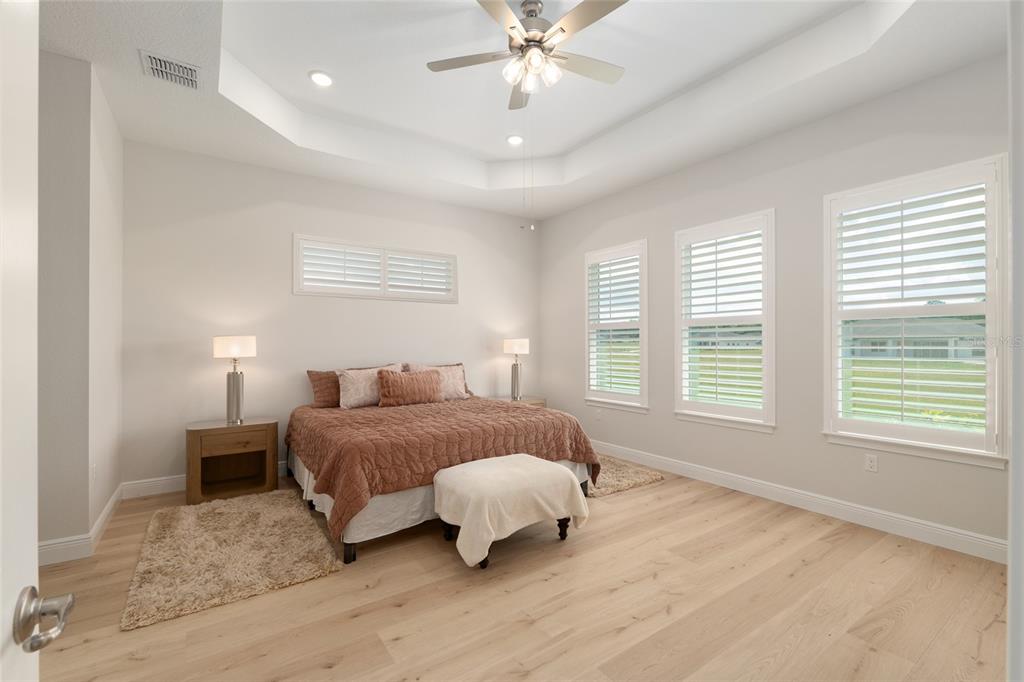 1929 Northwest 85th Loop Ocala, FL 34475 - Photo 28 of 55 a spacious bedroom with a bed and a window