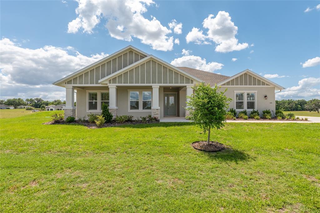 1929 Northwest 85th Loop Ocala, FL 34475 - Photo 3 of 55 a front view of a house with garden
