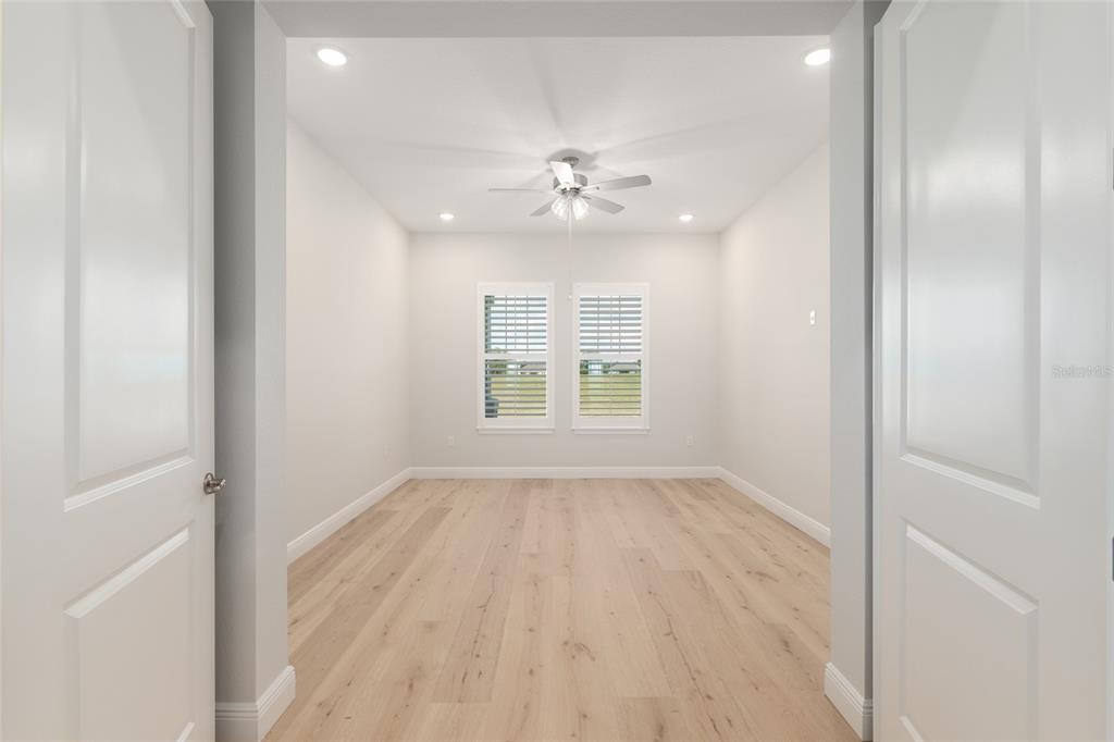 1929 Northwest 85th Loop Ocala, FL 34475 - Photo 36 of 55 wooden floor in an empty room with a window