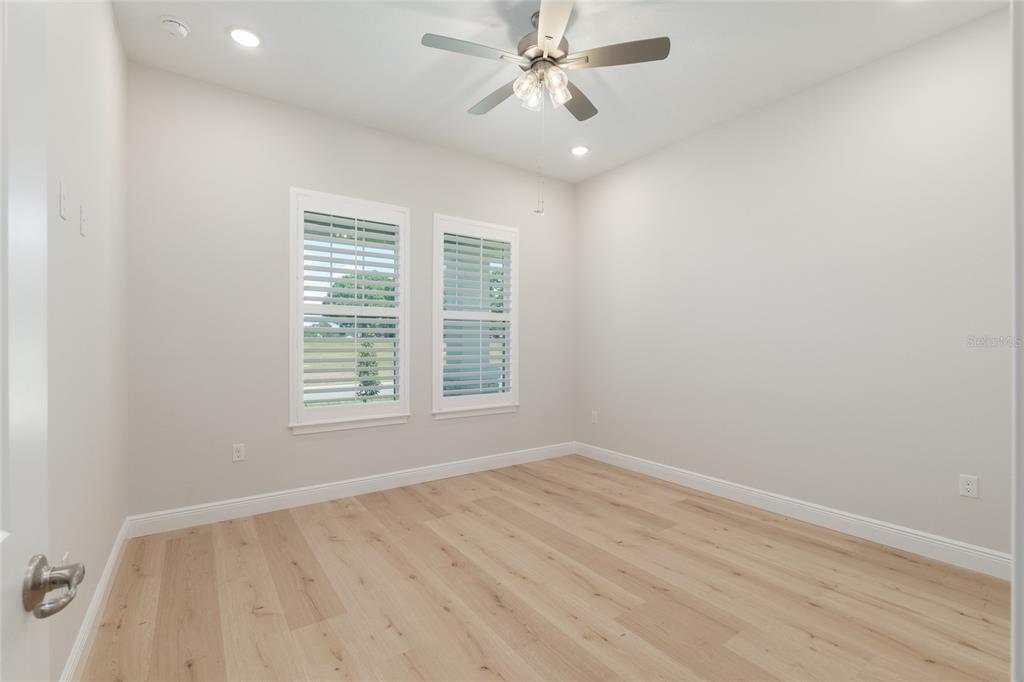 1929 Northwest 85th Loop Ocala, FL 34475 - Photo 39 of 55 wooden floor in an empty room with a window