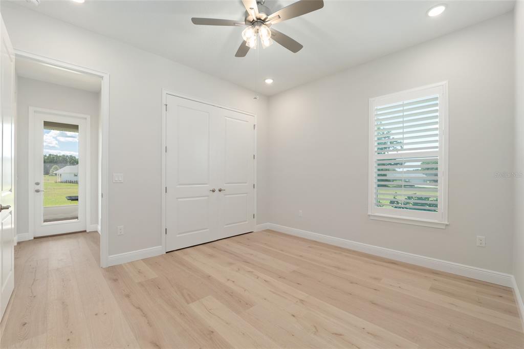 1929 Northwest 85th Loop Ocala, FL 34475 - Photo 43 of 55 wooden floor in an empty room with a window