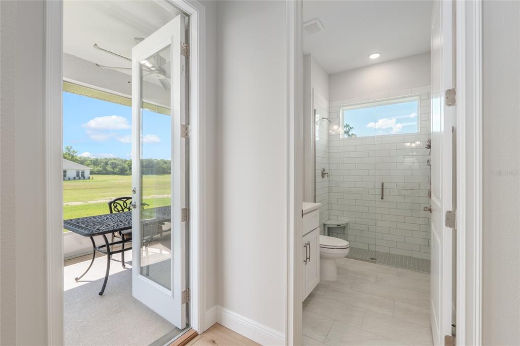 1929 Northwest 85th Loop Ocala, FL 34475 - Photo 44 of 55 a bathroom with a glass door shower and a toilet
