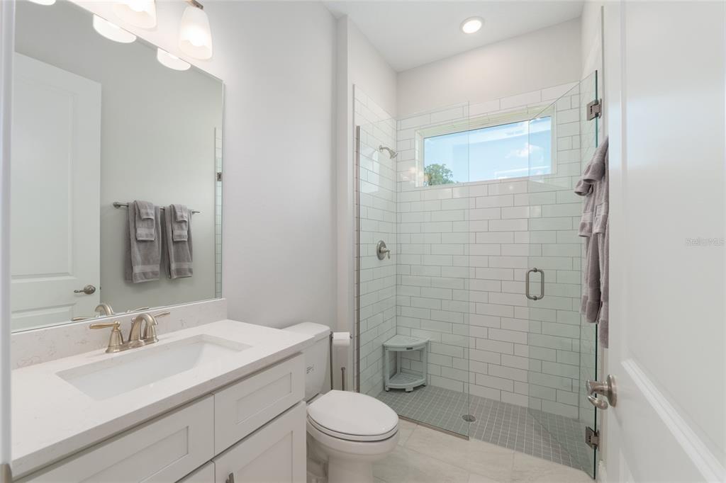1929 Northwest 85th Loop Ocala, FL 34475 - Photo 45 of 55 a bathroom with a sink a toilet and shower
