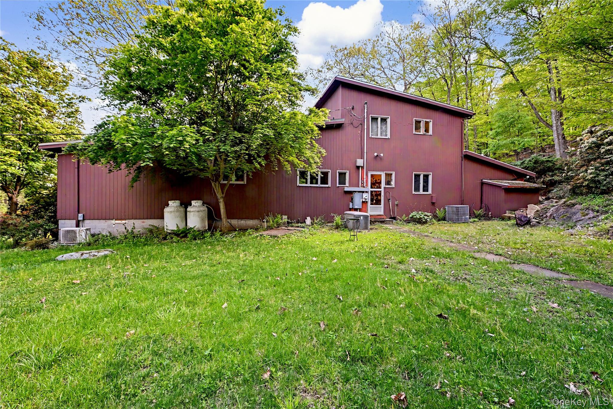 631 Croton Falls Road Carmel, NY 10512 - Photo 41 of 43 a view of a house with a yard and sitting area