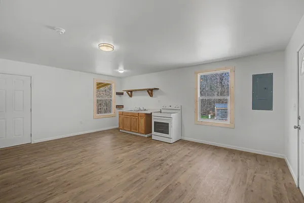 a view of a livingroom with furniture and wooden floor