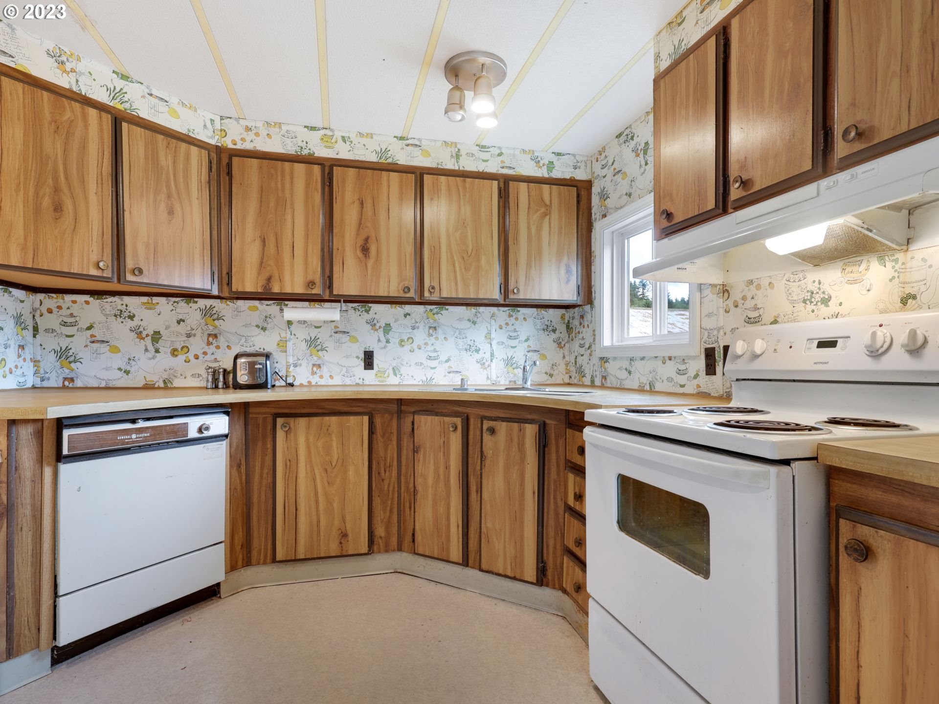 92074 Maki Road Astoria, OR 97103 - Photo 11 of 36 a kitchen with stainless steel appliances granite countertop a sink stove and cabinets