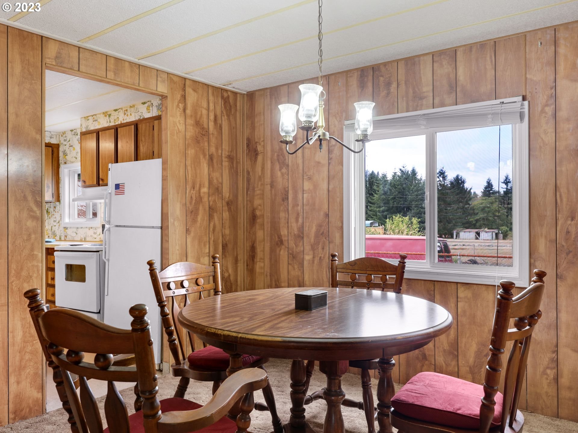 92074 Maki Road Astoria, OR 97103 - Photo 7 of 36 a view of a dining room with furniture window and wooden floor