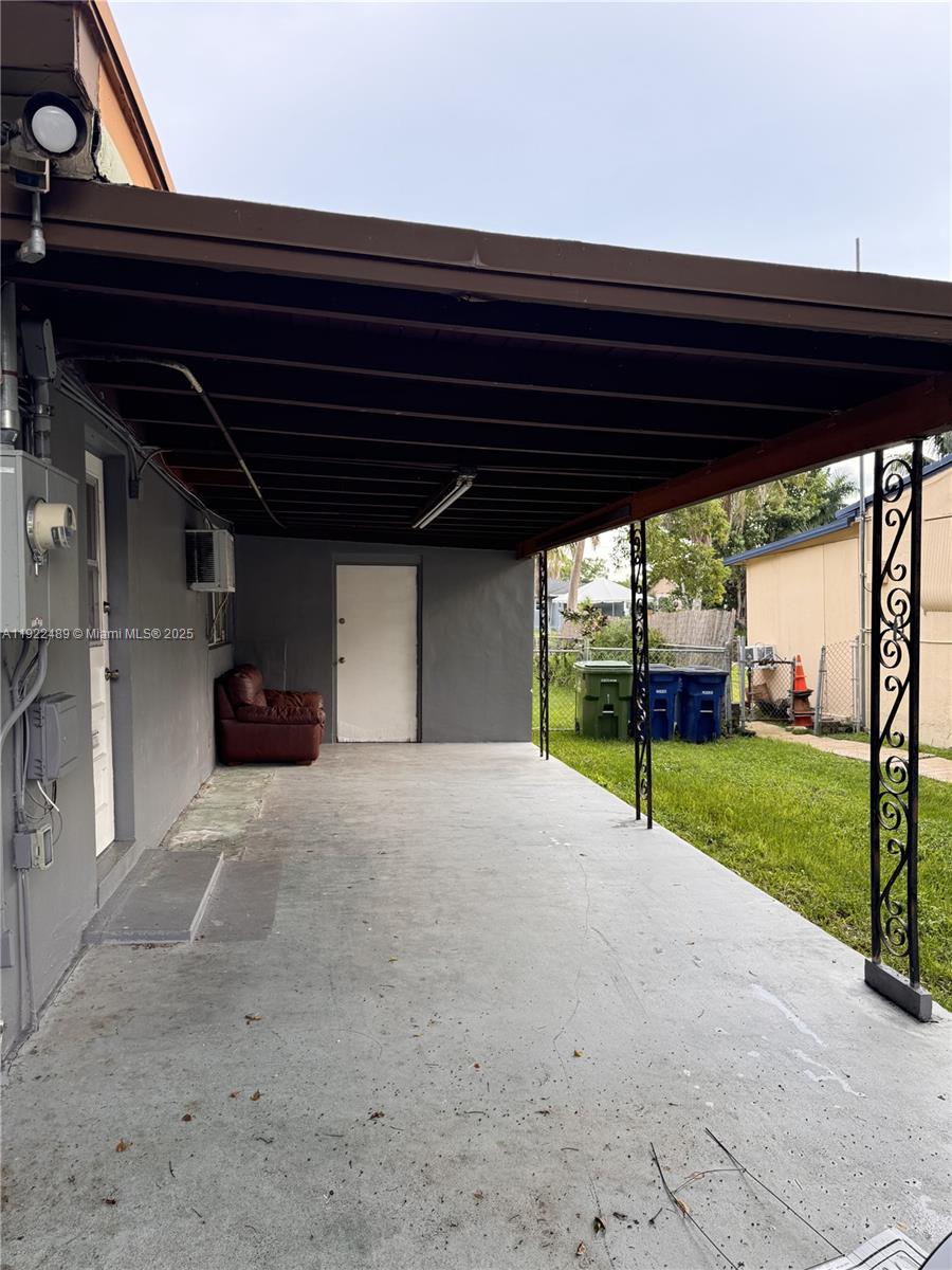 213 Southwest 5th Street Hallandale Beach, FL 33009 - Photo 8 of 17 a view of an empty room with a yard