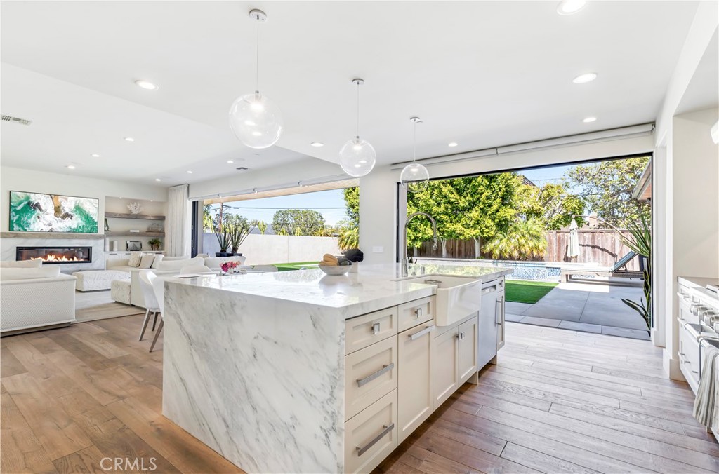 660 Kings Road Newport Beach, CA 92663 - Photo 9 of 41 a kitchen with kitchen island a large counter top space