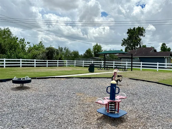 a swimming pool with outdoor seating and garden