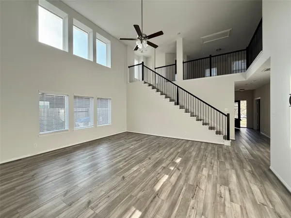 a view of an entryway with wooden floor