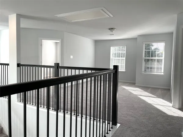 a view of a hallway with windows