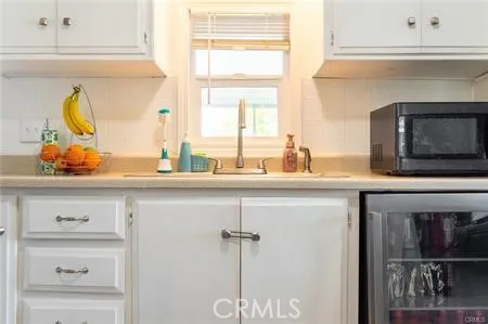 a stove top oven sitting inside of a kitchen