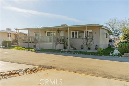 1134 Villa Calimesa Lane, Unit 42 Calimesa, CA 92320 - Photo 2 of 36 a view of a house with a backyard
