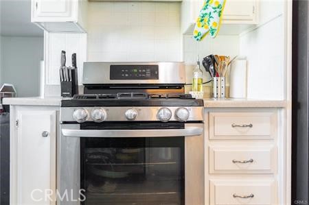 1134 Villa Calimesa Lane, Unit 42 Calimesa, CA 92320 - Photo 21 of 36 a stove top oven sitting inside of a kitchen