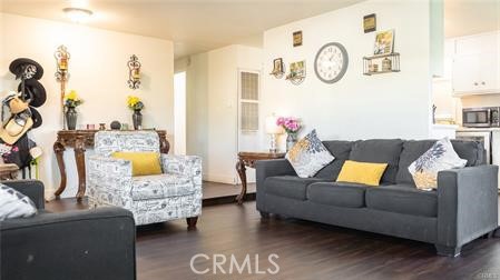 1134 Villa Calimesa Lane, Unit 42 Calimesa, CA 92320 - Photo 29 of 36 a living room with furniture and a clock