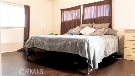 1134 Villa Calimesa Lane, Unit 42 Calimesa, CA 92320 - Photo 31 of 36 a bedroom with a bed and a night stand