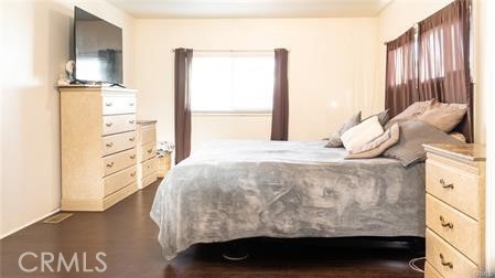 1134 Villa Calimesa Lane, Unit 42 Calimesa, CA 92320 - Photo 32 of 36 a bedroom with a bed and a window