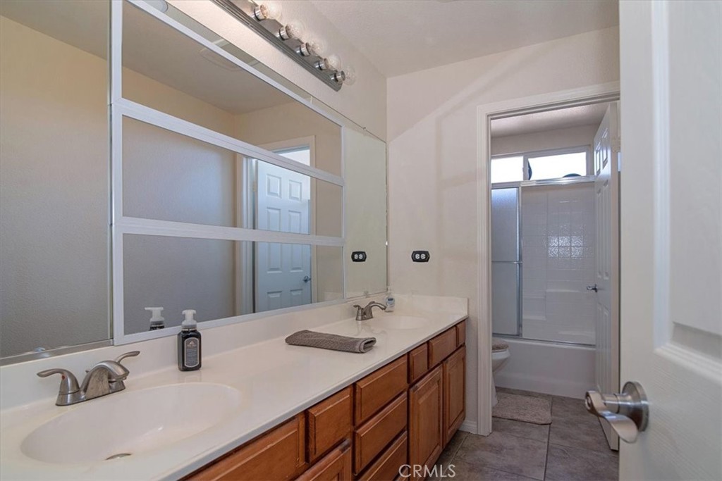 204 Brisa Del Mar Lompoc, CA 93436 - Photo 19 of 33 a bathroom with a sink double vanity and a mirror