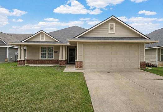 10124 Bunting Drive Waco, TX 76708 - Photo 1 of 18 a front view of a house with a yard and garage