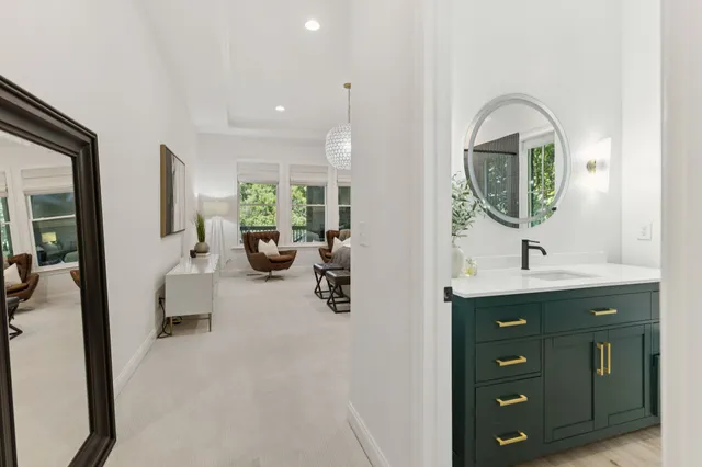 a living room with furniture and a potted plant