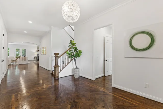 a living room with fireplace furniture and a wooden floor