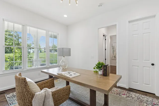 a living room with furniture flat screen tv and a fireplace