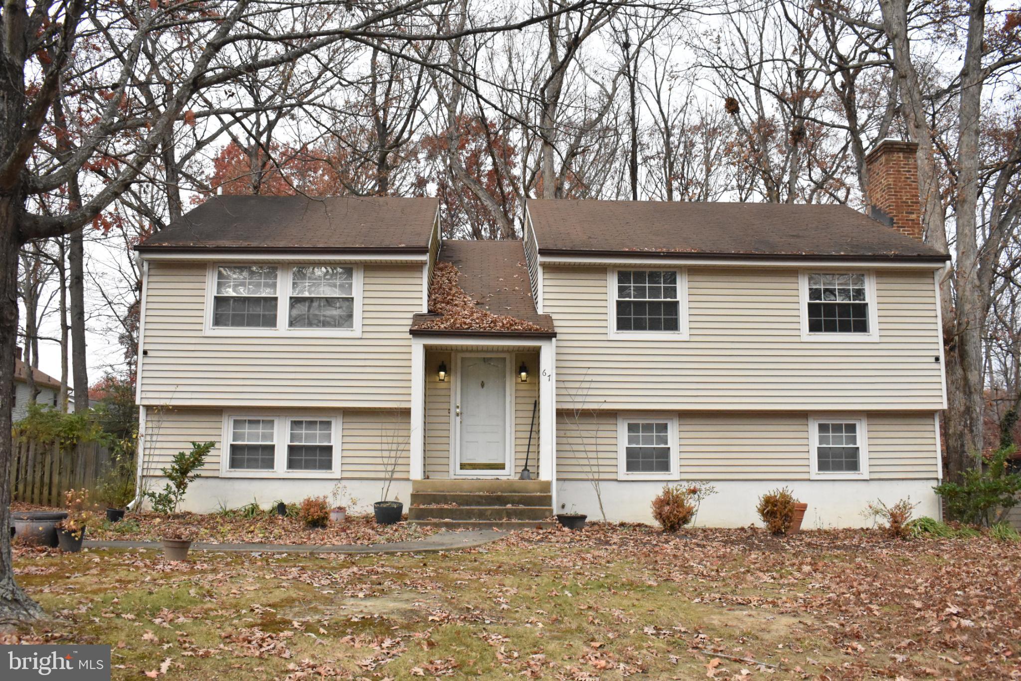 67 Devonne Drive Fredericksburg, VA 22407 - Photo 1 of 35 a front view of a house with a tree