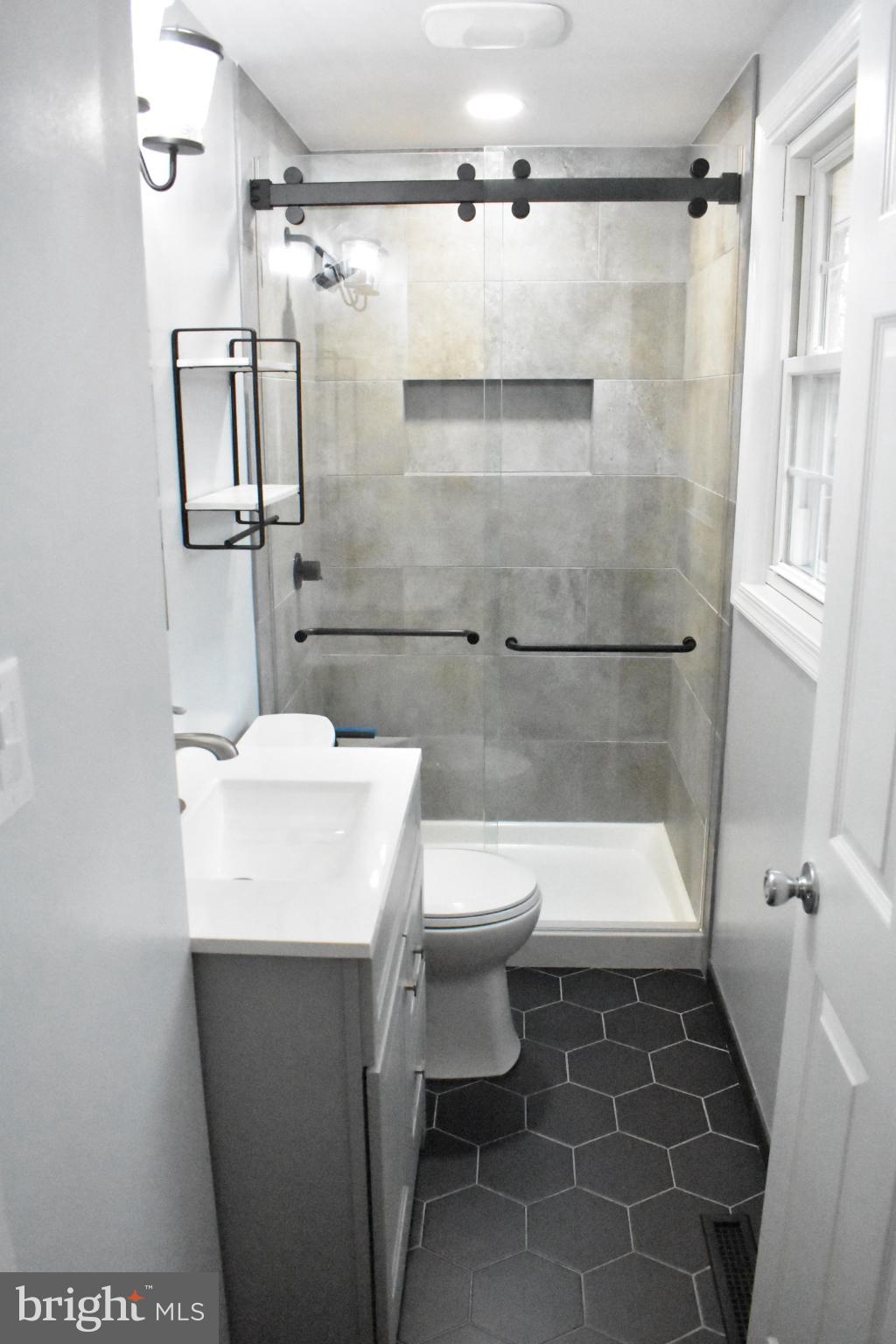 67 Devonne Drive Fredericksburg, VA 22407 - Photo 17 of 35 a bathroom with a sink toilet and shower