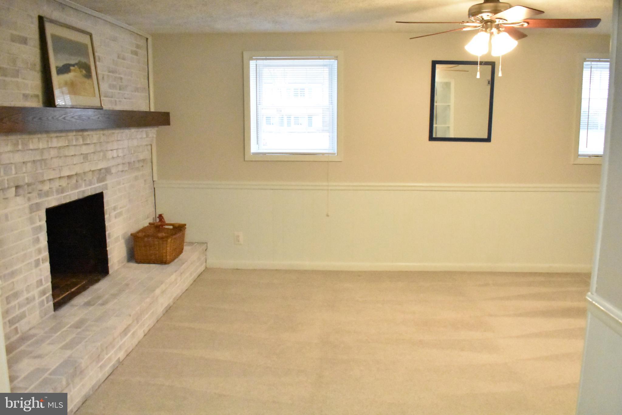 67 Devonne Drive Fredericksburg, VA 22407 - Photo 21 of 35 a living room with furniture and a fireplace