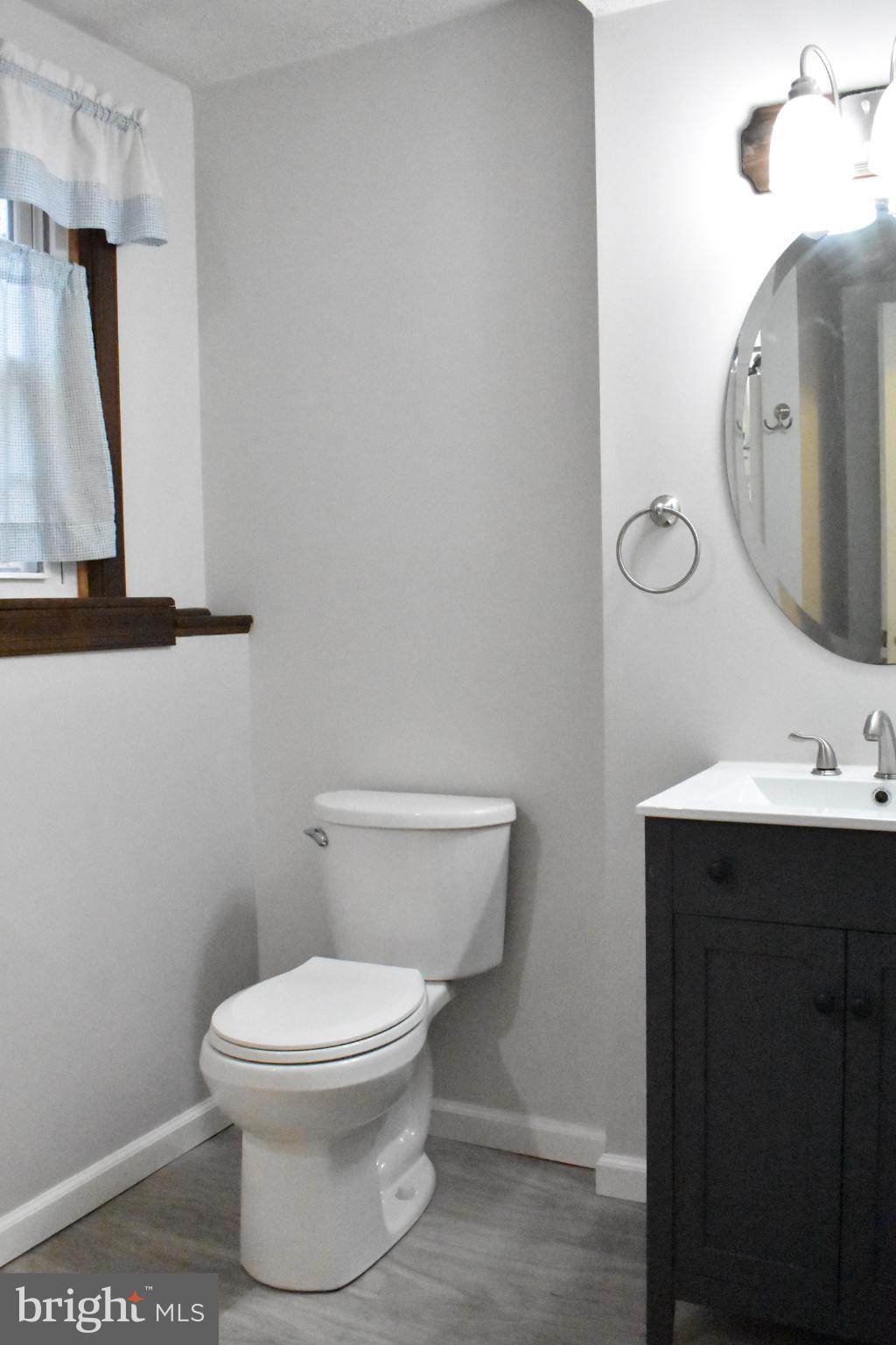 67 Devonne Drive Fredericksburg, VA 22407 - Photo 24 of 35 a white toilet sitting next to a bathroom sink