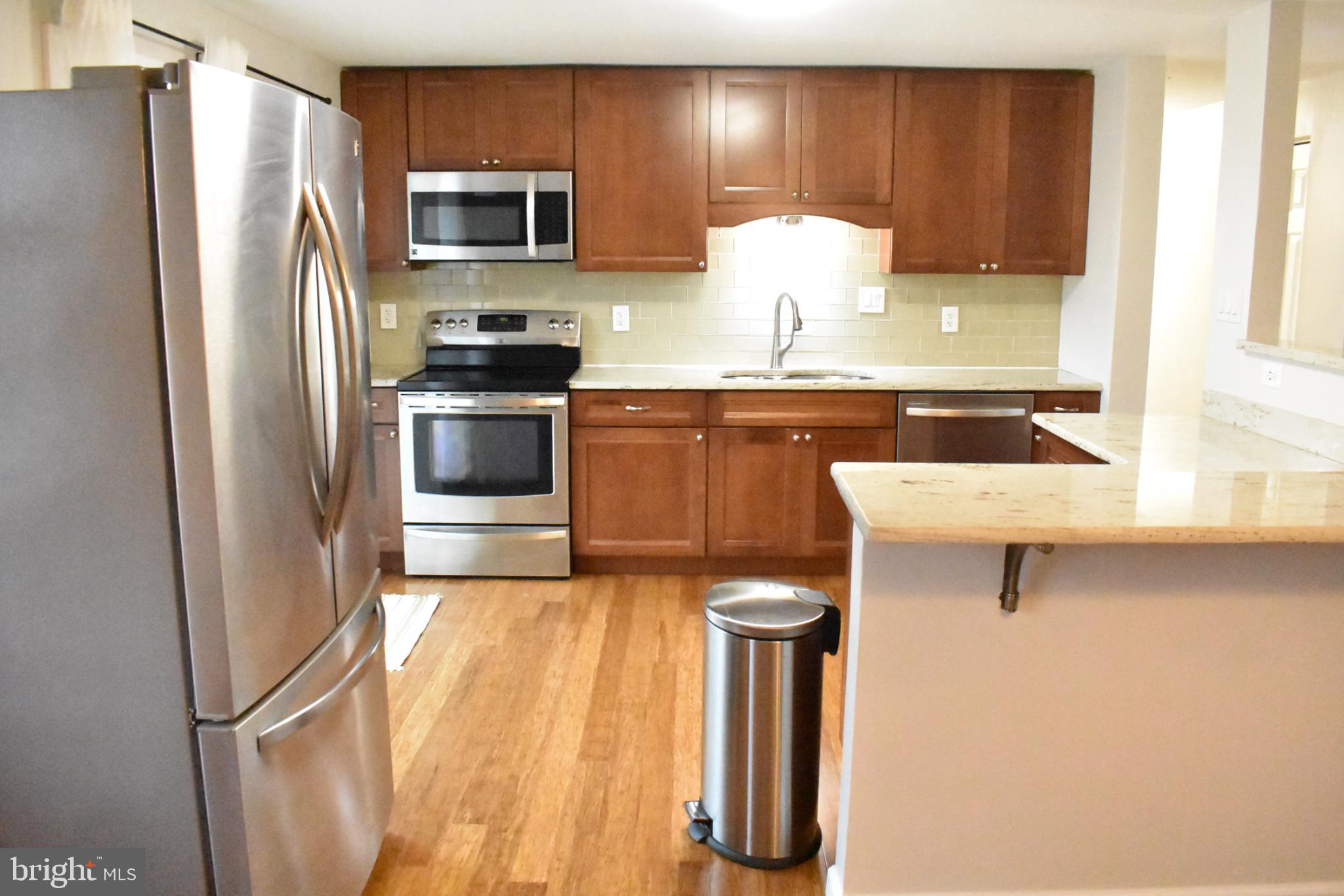 67 Devonne Drive Fredericksburg, VA 22407 - Photo 8 of 35 a kitchen with a refrigerator and a sink