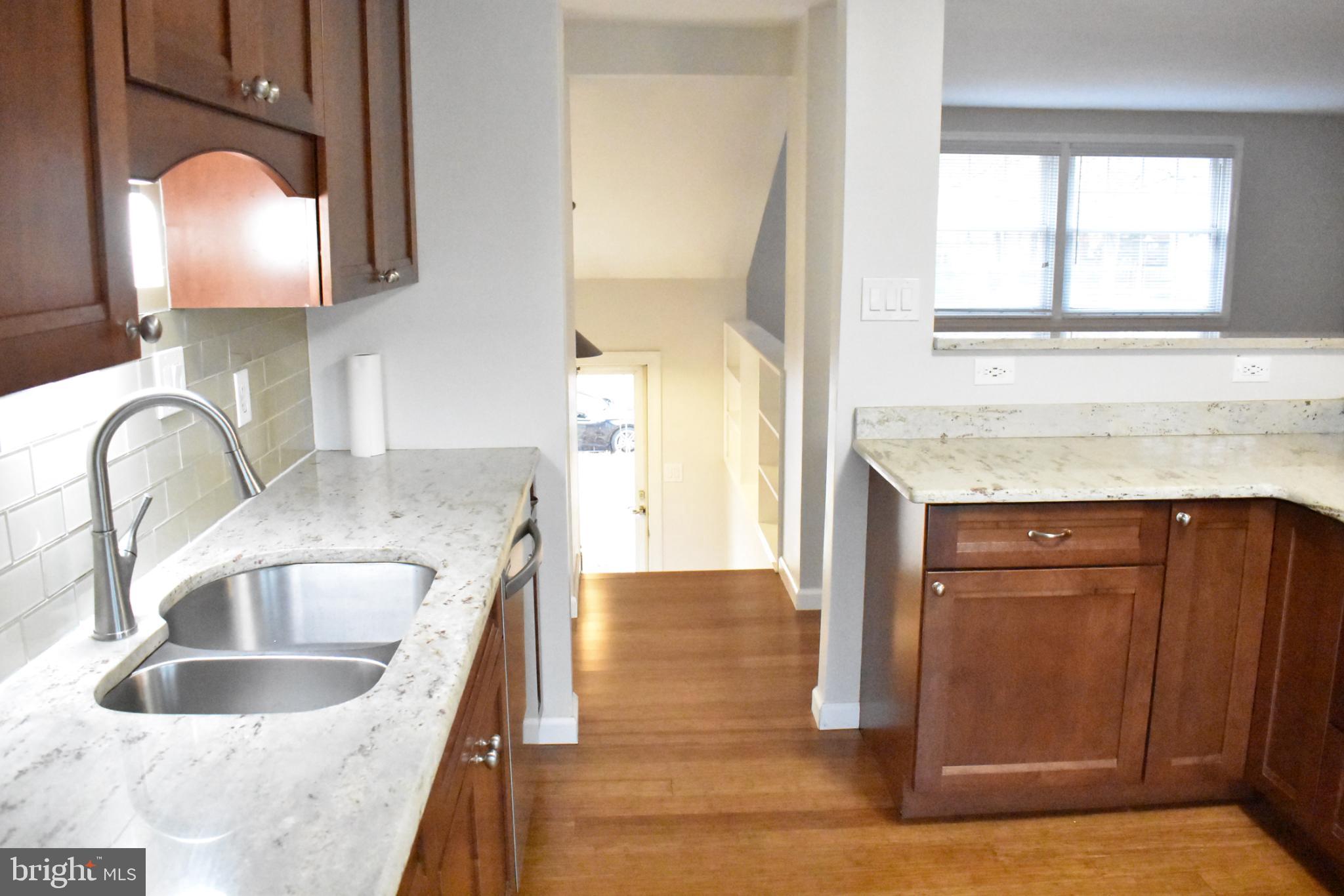 67 Devonne Drive Fredericksburg, VA 22407 - Photo 10 of 35 a kitchen with granite countertop a sink and a window