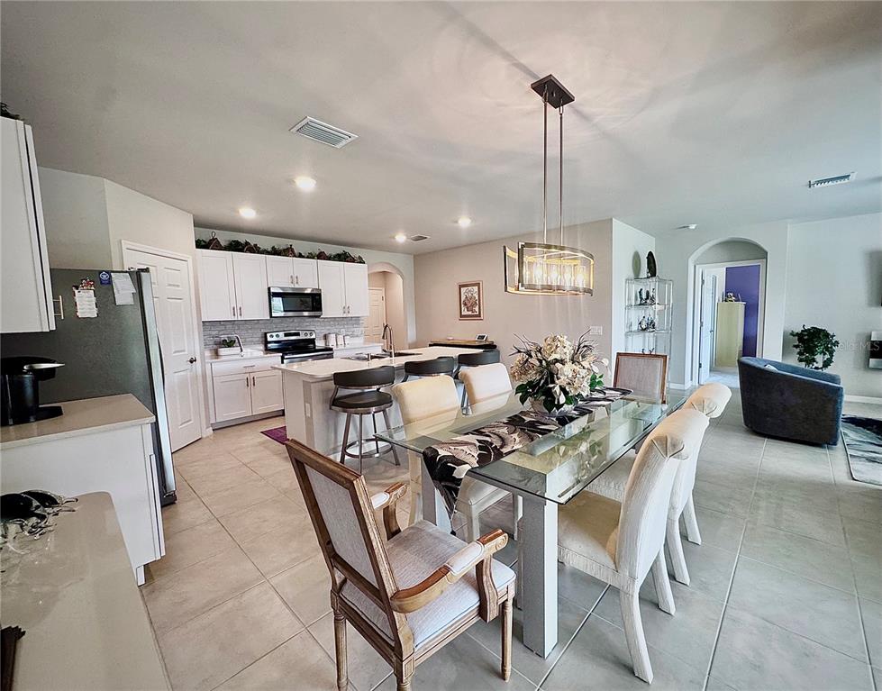 4077 Manatee Lane Punta Gorda, FL 33980 - Photo 12 of 35 a view of a dining room with furniture