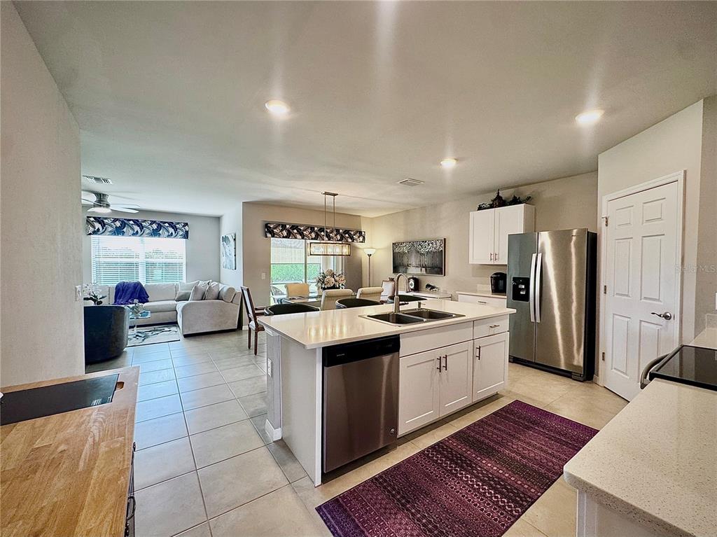 4077 Manatee Lane Punta Gorda, FL 33980 - Photo 14 of 35 a large kitchen with a lot of counter space and refrigerator
