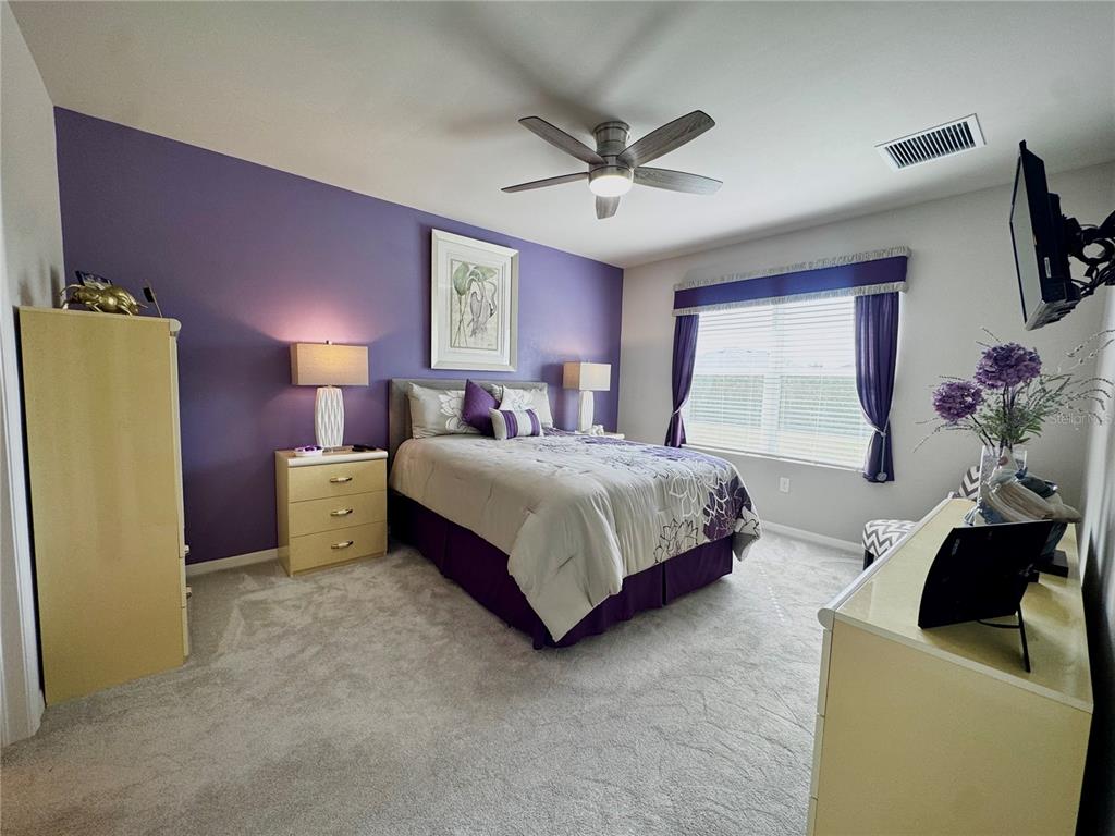 4077 Manatee Lane Punta Gorda, FL 33980 - Photo 16 of 35 a bedroom with a bed dresser and window