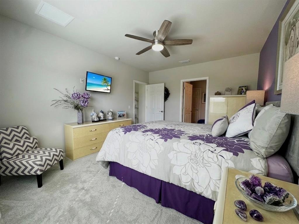 4077 Manatee Lane Punta Gorda, FL 33980 - Photo 18 of 35 a bed room with a bed and a couch
