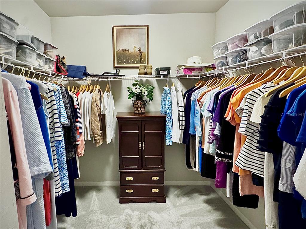 4077 Manatee Lane Punta Gorda, FL 33980 - Photo 22 of 35 a view of walk in closet with clothes and shoes