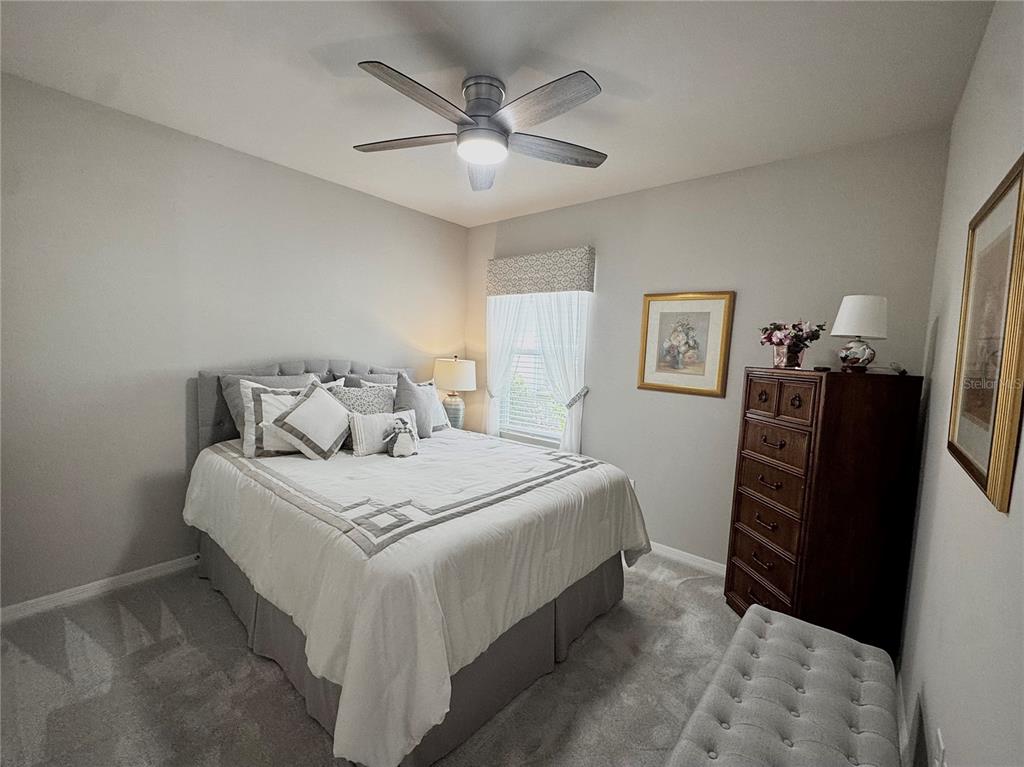 4077 Manatee Lane Punta Gorda, FL 33980 - Photo 23 of 35 a bedroom with a bed and a refrigerator